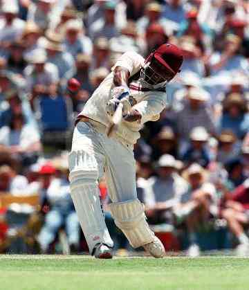 Windies captain Brian Lara drives for four